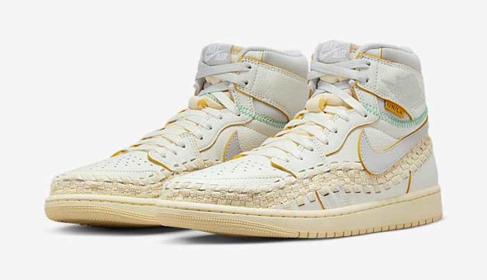 Side view of white and grey Air Jordan sneakers.